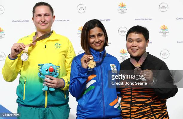 Silver medalist Elena Galibovitch of Australia, gold medalist Heena Sidhu of India and bronze medalist Alia Sazana Azahari of Malaysia pose during...