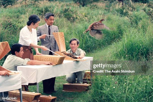 Emperor Akihito and Empress Michiko release birds at the Nasu Imperial Villa on August 23, 1990 in Nasu, Tochigi, Japan.