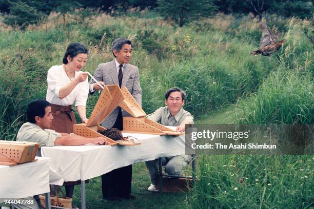 Emperor Akihito and Empress Michiko release birds at the Nasu Imperial Villa on August 23, 1990 in Nasu, Tochigi, Japan.