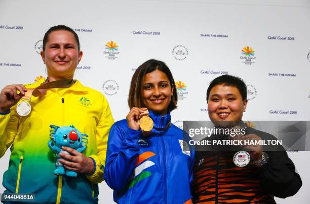 Silver medallist Australia's Elena Galiabovitch, gold medallist India's Heena Sidhu and bronze medallist Malaysia's Alia Sazana Azahari on the podium...