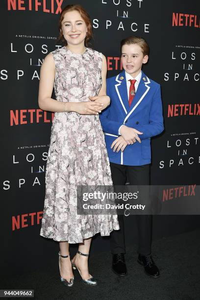 Mina Sundwall and Maxwell Jenkins attend the "Lost In Space" Season 1 Premiere at ArcLight Cinerama Dome on April 9, 2018 in Hollywood, California.