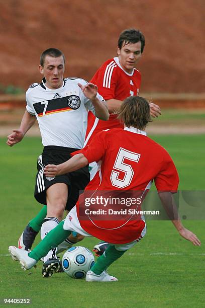 Kevin Bosseler of Germany is challenged by Zsolt Tobias of Hungary during the Under-18 international friendly on December 14, 2009 in Kfar Saba,...