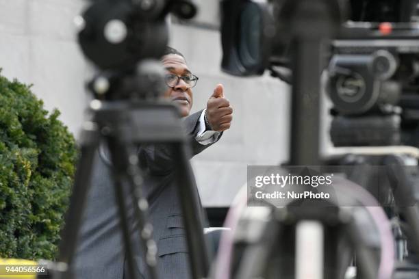 Bill Cosby's spokesperson Andrew Wyatt walks past cameras outside Montgomery County Courthouse, in Norristown, PA on April 9, 2018 as the sexual...