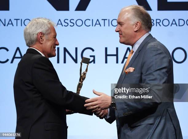 Jeopardy!" host Alex Trebek is inducted into the National Association of Broadcasters Broadcasting Hall of Fame by Hearst Television Inc. President...