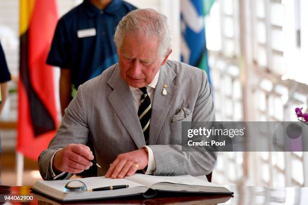 Prince Charles, Prince of Wales signs the visitor book a reception at Government House on April 10, 2018 in Darwin, Australia. The Prince of Wales...