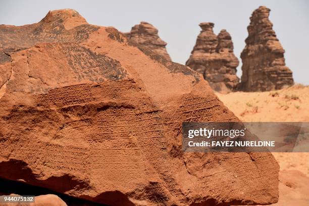 Picture taken March 31, 2018 shows inscription on rose-coloured sandstone in the Nabataean archaeological site of al-Hijr near the northwestern town...