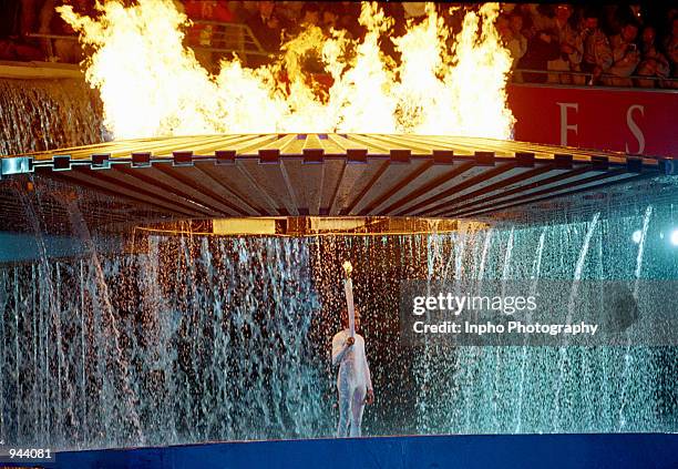 The Cauldron containing the Olympic Flame rises above Torch Bearer Cathy Freeman of Australia during the Opening Ceremony of the Sydney 2000 Olympic...