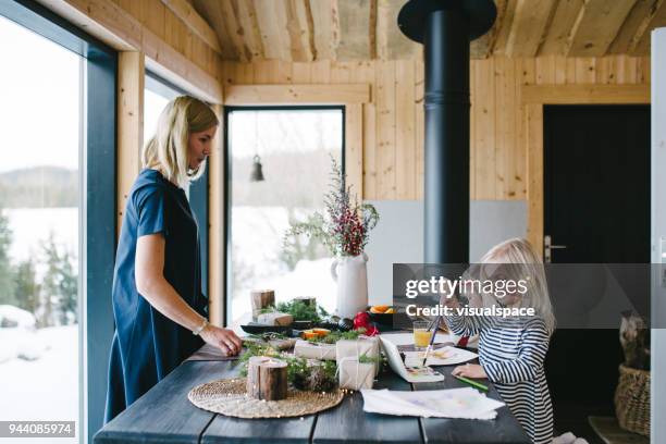 mother with two child using watercolour paints during christmas - christmas scandinavia stock pictures, royalty-free photos & images