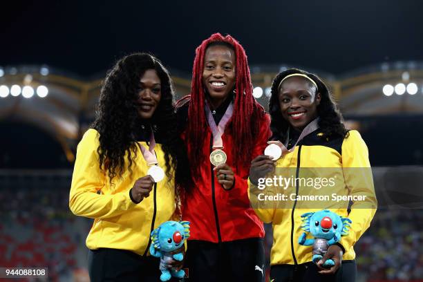 Silver medalist Christania Williams of Jamaica, gold medalist Michelle-Lee Ahye of Trinidad and Tobago and bronze medalist Gayon Evans of Jamaica...
