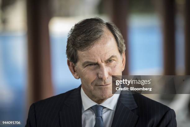 Mike Wells, chief executive officer of Prudential Plc, listens during a Bloomberg Television interview on the sidelines of the Boao Forum for Asia...