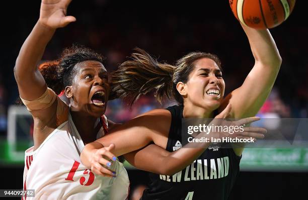 Erin Kalani Purcell of New Zealand contests the ball with Deolinda Gimo of Mozambique during the womens Qualifying Final between Mozambique and New...