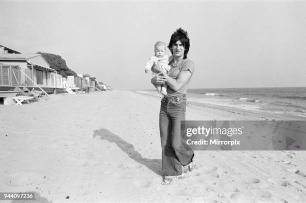 Ronnie Wood, guitarist with The Rolling Stones, part of the picture set with his wife Krissie, and baby Jesse James Wood, at their Malibu,...