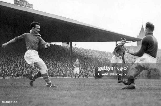 English League Division One match at Old Trafford, Manchester United 1 v Cardiff City 4, Sixteen year old Duncan Edwards watches as Cardiff inside...