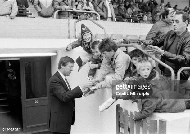 New Manchester United manager Alex Ferguson signs autographs for young Oxford United fans at the Manor Ground before his first match in charge as...