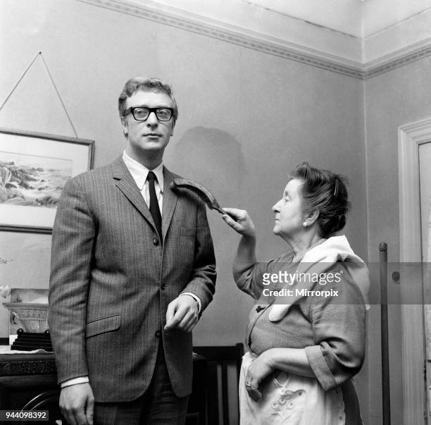 Actor Michael Caine at home with his mother, Ellen, 2nd February 1964.