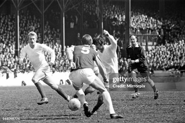 Manchester United footballer George Best in action during the match against West Ham United at Upton Park watched by teammate Denis Law. United won...
