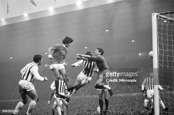 Manchester United footballer George Best in action to score his second goal with a header past West Bromwich Albion goalkeeper John Osborne during...