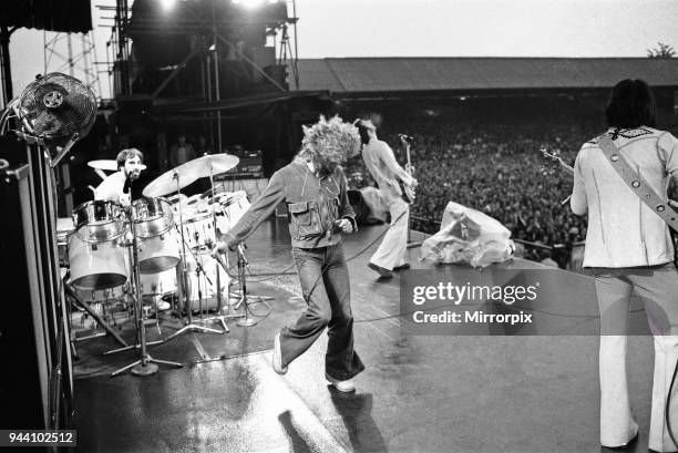 The Who rock group performing at The Valley, home of Charlton Athletic football club. Pictured left to right are: Keith Moon on drums, singer Roger...