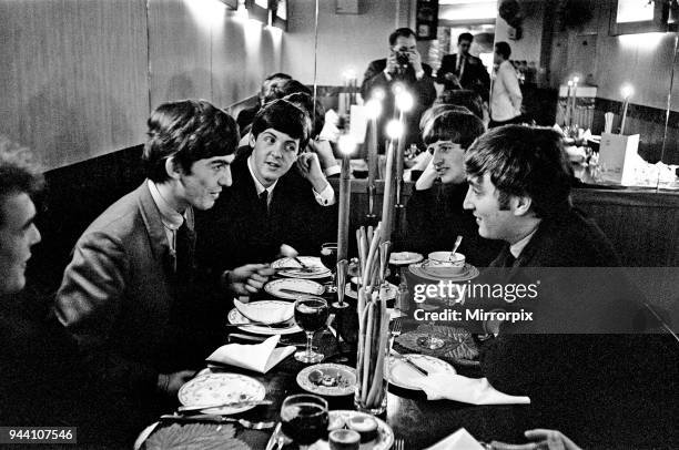 The Beatles, at lunch, London, Left to Right: Road Manager Neil Aspinall in the bottom left corner , then George Harrison, Paul McCartney, Ringo...