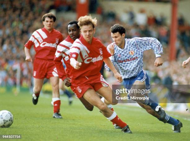 English League Division One match at Anfield, Liverpool 2 v Manchester United 0, United's Ryan Giggs takes the ball between Liverpool players Michael...
