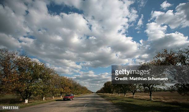 Car drives down the street which connects Ukrania and Moldavia on October 19, 2008 near Tiraspol, Moldova. Tiraspol is the second largest city in...