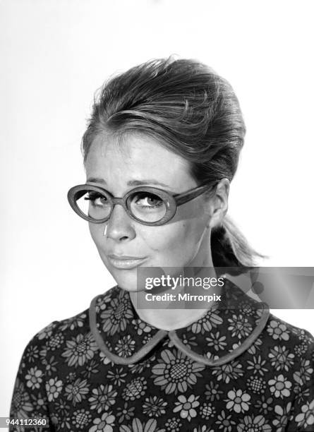 Spectacle Frames: Woman seen here modelling the latest fashionable spectacle frame designs. Model: Marilyn Rickard, 1966.