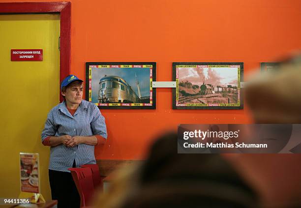Waitress waits for orders in one of the very few open restaurants on October 19, 2008 in Tiraspol, Moldova. Tiraspol is the second largest city in...