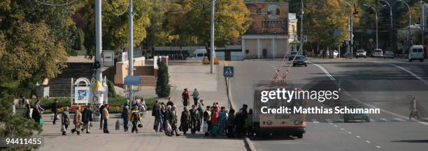 People queue at a bus October 19, 2008 in Tiraspol in the Transnistria region in Moldova. Tiraspol is the second largest city in Moldova and is the...