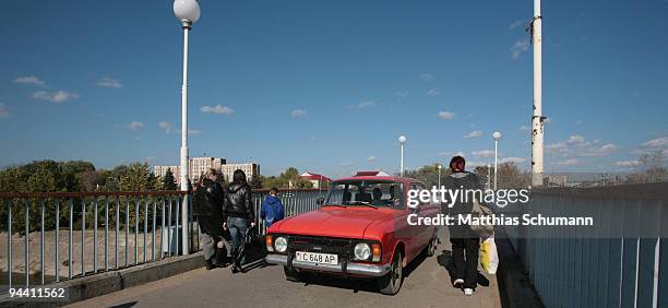 Car crosses the river Dniestre on a passenger bridge on October 19, 2008 in Tiraspol, Moldova. Tiraspol is the second largest city in Moldova and is...