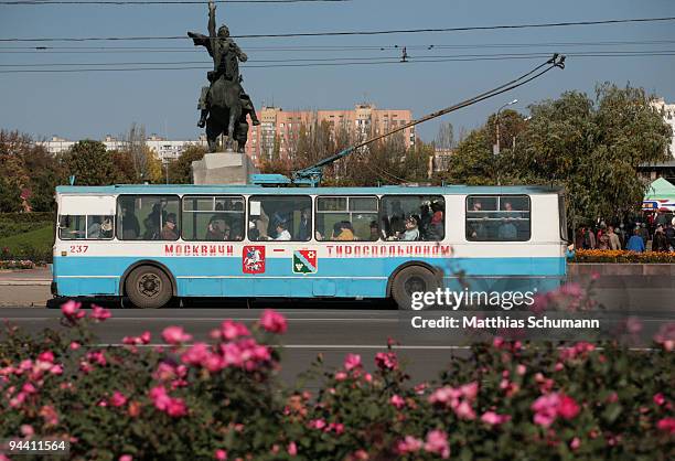 Bus stands October 19, 2008 in front of the statue of Alexander Suvorov the founder of Tiraspol in the Transnistrian region in Moldova. Tiraspol is...