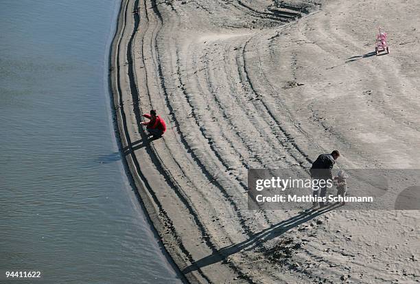 Man and his child play at the bank of the river Dniester on October 19, 2008 in Tiraspol, Moldova. Tiraspol is the second largest city in Moldova and...
