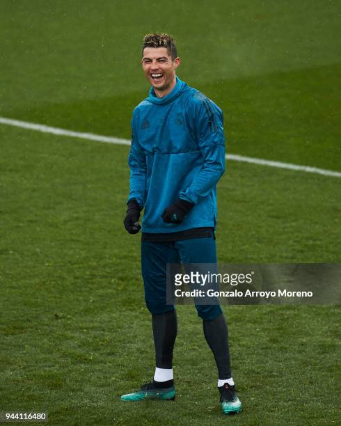 Cristiano Ronaldo of Real Madrid CF jokes with his team mates during a training session ahead of their UEFA Champions LEague quarter final second leg...