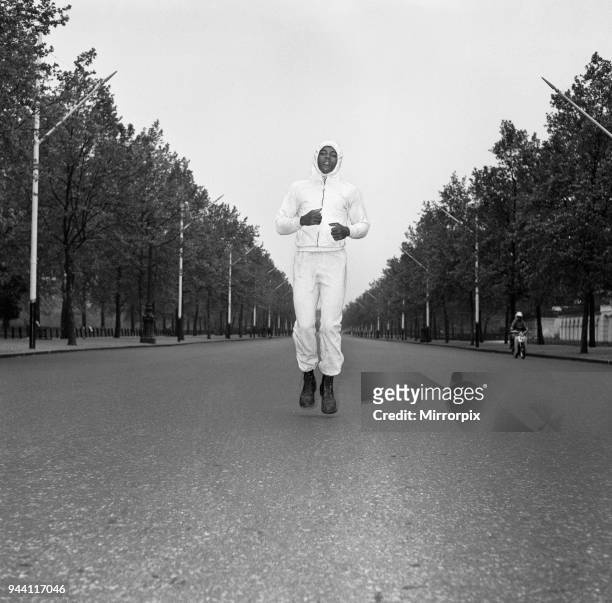 Cassius Clay aka running in The Mall London ahead of his first fight with Henry Cooper, Clay left his room a the Piccadilly Hotel at 6am to train,...