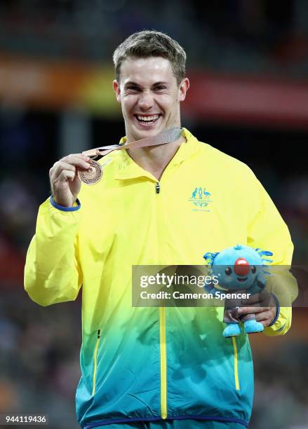 Bronze medalist Nicholas Hough of Australia poses during the medal ceremony for the Mens 110 hurdles during the Athletics on day six of the Gold...