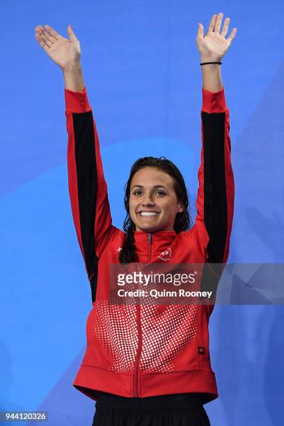 Silver medalist Kylie Masse of Canada poses during the medal ceremony for the Women's 50m Backstroke Final on day six of the Gold Coast 2018...