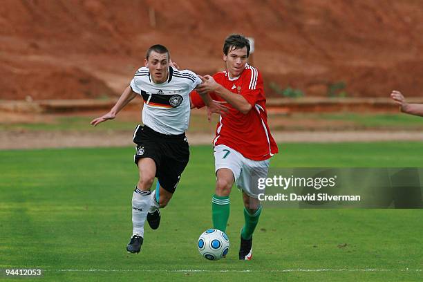 Kevin Bosseler of Germany and Matyas Magos of Hungary battle for the ball during the Under-18 international friendly on December 14, 2009 in Kfar...
