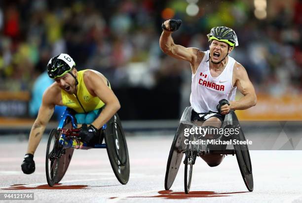 Alexandre Dupont of Canada celebrates winning gold ahead of Kurt Fearnley of Australia in the Mens T54 1500 metres during the Athletics on day six...