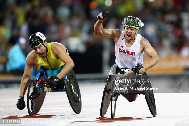 Alexandre Dupont of Canada celebrates winning gold ahead of Kurt Fearnley of Australia in the Mens T54 1500 metres during the Athletics on day six...