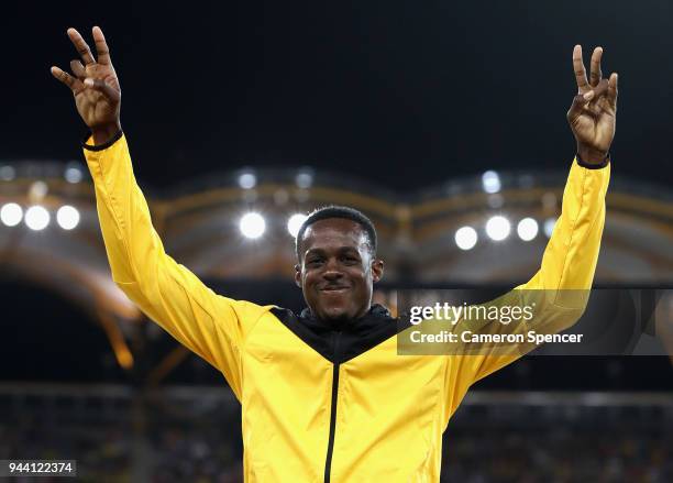 Gold medalist Ronald Levy of Jamaica celebrates during the medal ceremony for the Mens 110 hurdles during the Athletics on day six of the Gold Coast...
