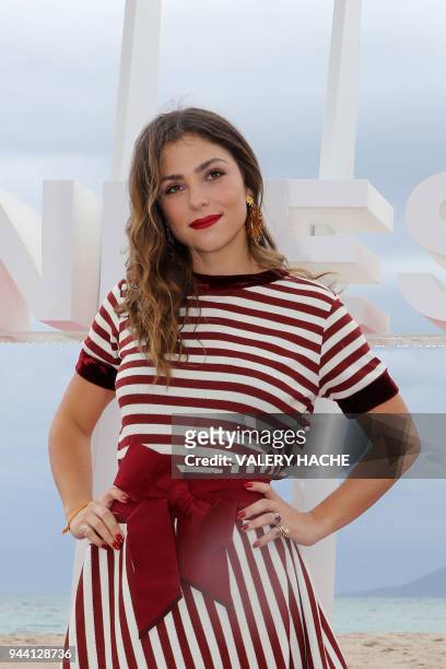 Colombian actress Paulina Davila poses during a photocall for "Aqui en la tierra", on April 10, 2018 in Cannes, as part of Canneseries International...