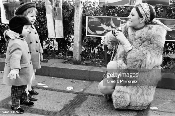Joan Collins on the set of her new film 'Subterfuge' with her children Sacha and Tara Newley, 4th February 1968.