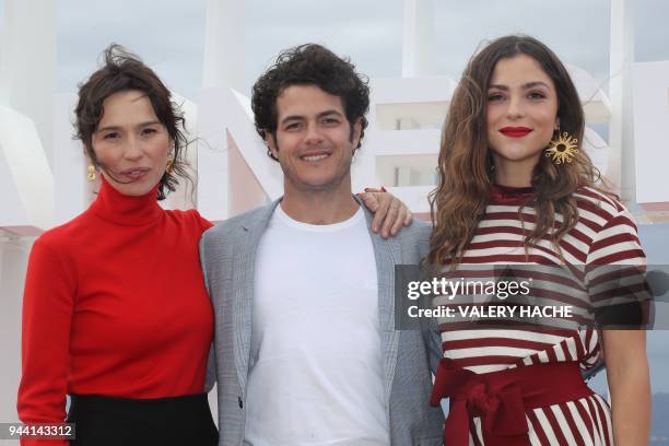 Spanish actress Ariadna Gil, Mexican actor Alfonso Dosal and Colombian actress Paulina Davila pose during a photocall for "Aqui en la tierra", on...