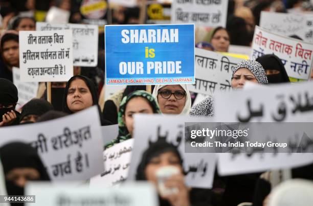 Muslim women display placards during a protest against 'Triple Talaq' bill in New Delhi.