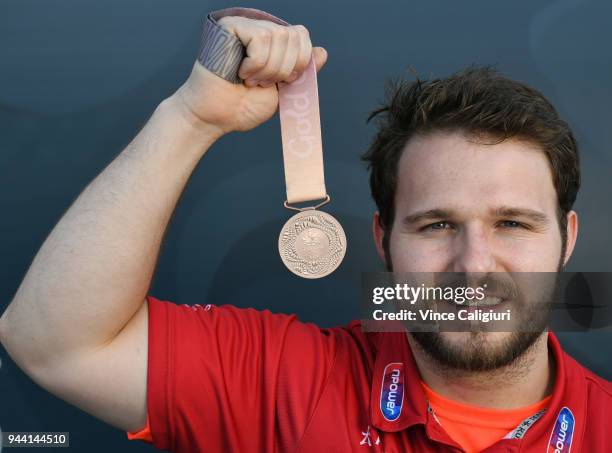 Owen Boxall of England poses with his Bronze medal at team England Headquarters in Main Beach on day six of the Gold Coast 2018 Commonwealth Games on...