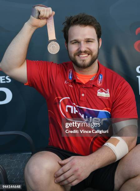 Owen Boxall of England poses with his Bronze medal at team England Headquarters in Main Beach on day six of the Gold Coast 2018 Commonwealth Games on...