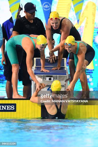 Australia's Bronte Campbell is congratulated by team mates Emily Seebohm, Georgia Bohl and Emma Mckeon after winning the swimming women's 4x100m...