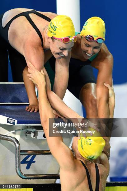 Emily Seebohm, Emma McKeon and Bronte Campbell of Australia celebrate victory in the Women's 4 x 100m Medley Relay Final on day six of the Gold Coast...