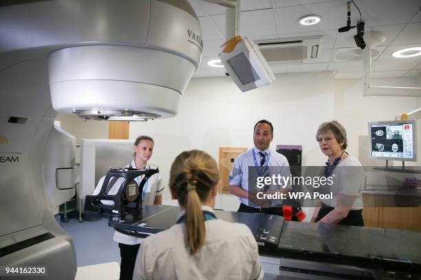 British Prime Minister Theresa May is shown the advanced radiotherapy system during a visit to announce new funding and research into prostate cancer...