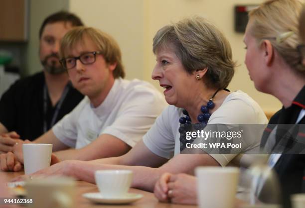 British Prime Minister Theresa May meets hospital staff during a visit to Addenbrooke's Hospital on April 10, 2018 in Cambridge, England.