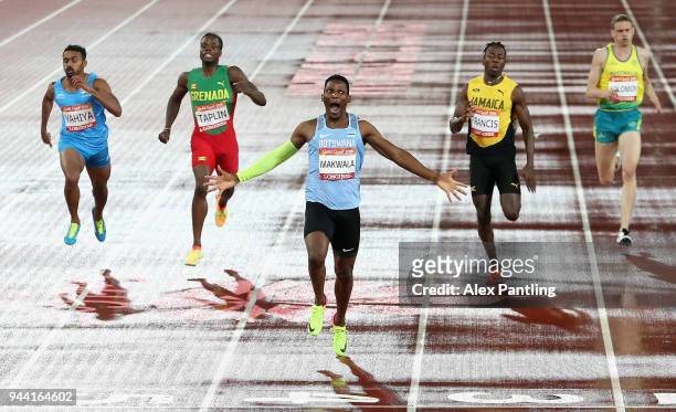 Isaac Makwala of Botswana celebrates winning gold as he crosses the line in the Men's 400 metres final during the Athletics on day six of the Gold...